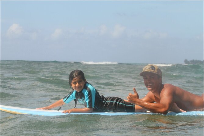 Beginner Surf Lesson at North Shore Haleiwa, Oahu - Catching waves during the 1.5 to 2 hour water session