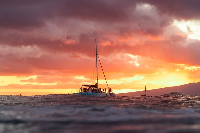 Board from Waikiki Beach for a scenic Sunset Sail on the Hāwea - Boarding Through the Surf