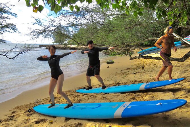 Group Surf Lessons for beginners on the North Shore of Oahu - Building balance, turns, and wave timing