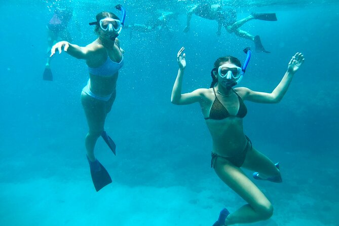 Hawaiian Culture & Snorkel Adventure with Photo/Videos - Swimming gently toward Oahus marine life