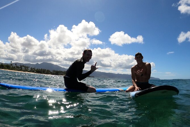 Learn to surf with a local big wave rider on the North Shore of Oahu - Moving into the water at a beginner-friendly break
