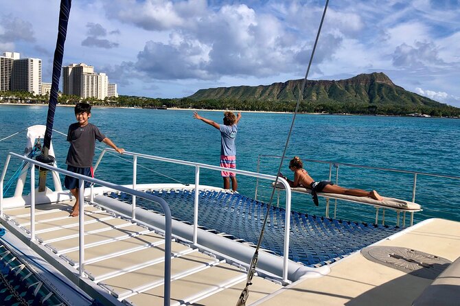 Moana’s Swim’n’Sail Cocktail Cruise Along the Waikiki Coast - Sailing out past Waikiki toward Diamond Head