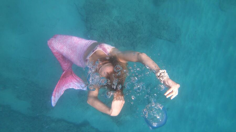 Oahu: Honolulu Mermaid Snorkel Adventure with Videos - Putting on the tail and learning the poses